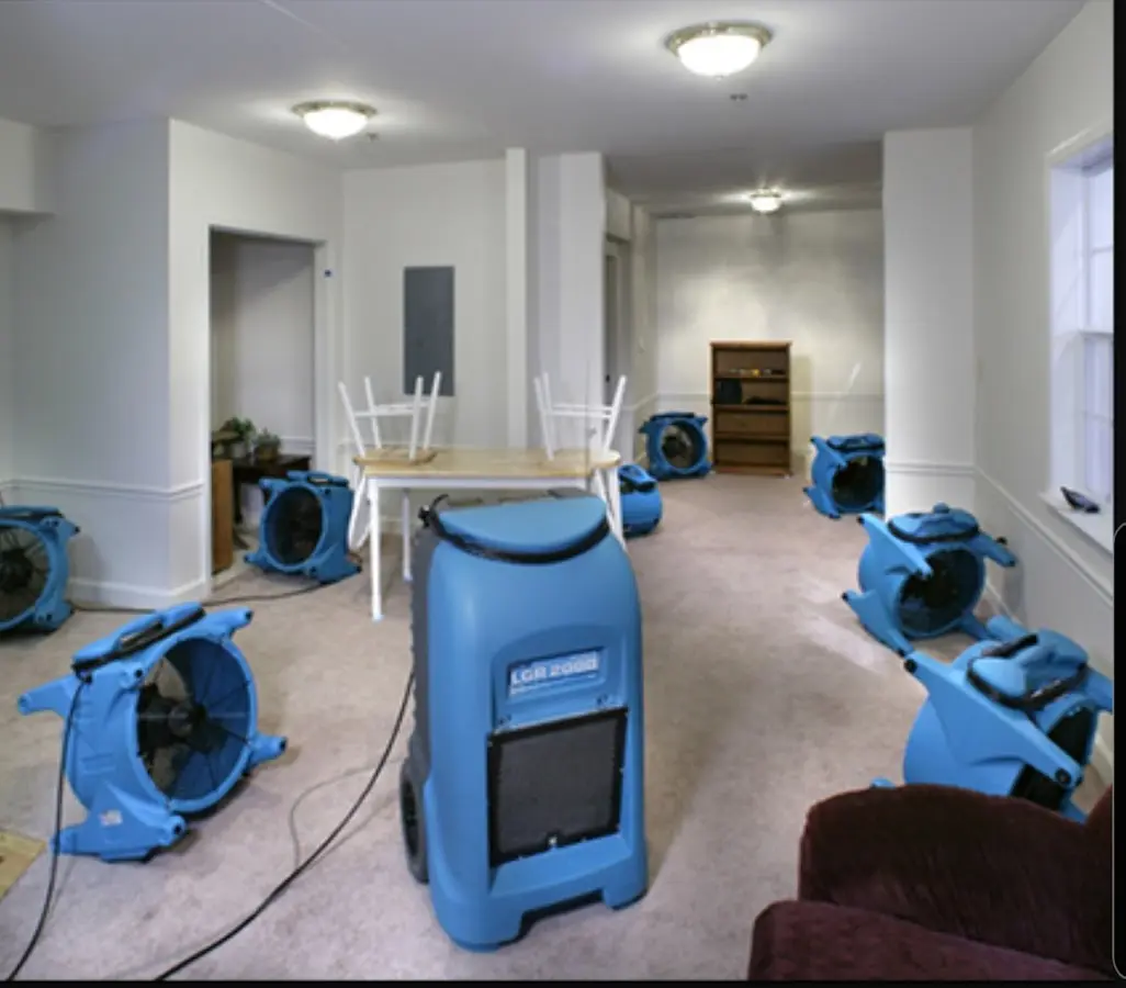 Air movers and dehumidifier setup for Water Damage Restoration in Monitor
